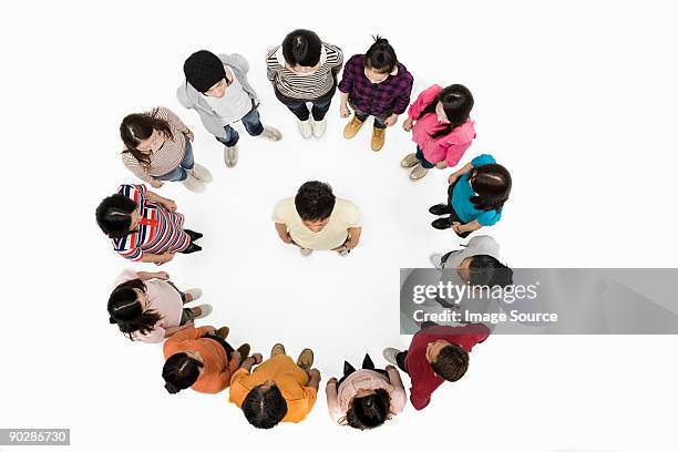 man in circle of people - surrounding ストックフォトと画像