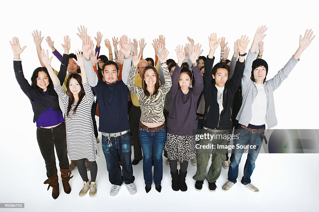 People with arms raised