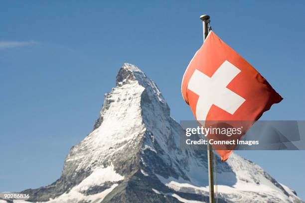 swiss flag and matterhorn - swiss culture stock pictures, royalty-free photos & images