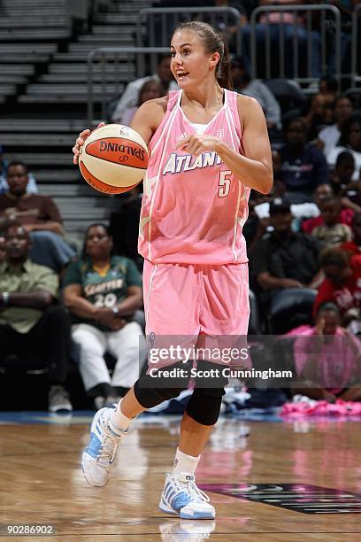 Shalee Lehning of the Atlanta Dream brings the ball up court during the WNBA game against the Seattle Storm on August 15, 2009 at Philips Arena in...