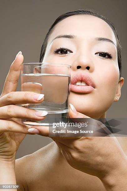 young woman with glass of water - drinking glass isolated stock pictures, royalty-free photos & images
