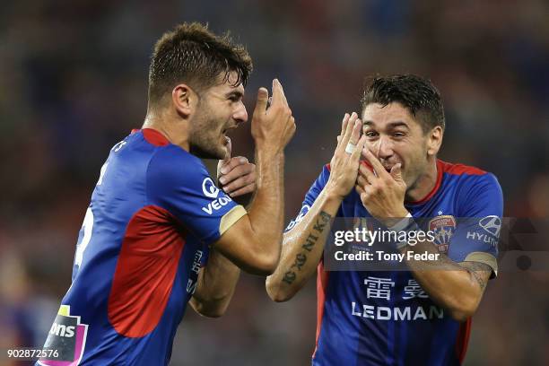 Dimitri Petratos of the Jets celebrates with team mate Ivan Vujica during the round 15 A-League match between the Newcastle Jets and the Central...