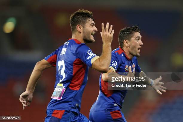 Dimitri Petratos of the Jets celebrates with team mate Ivan Vujica during the round 15 A-League match between the Newcastle Jets and the Central...