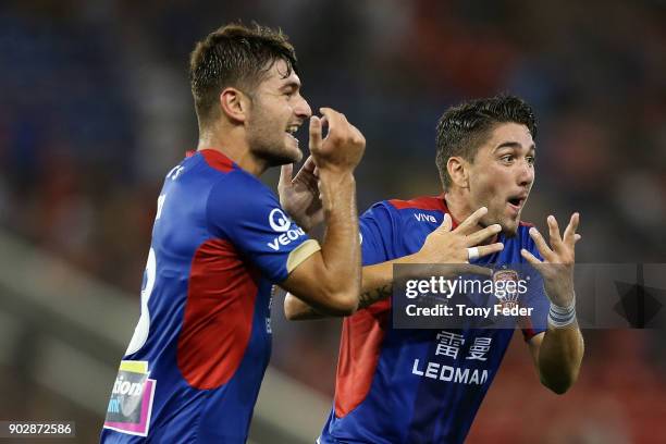 Dimitri Petratos of the Jets celebrates with team mate Ivan Vujica during the round 15 A-League match between the Newcastle Jets and the Central...