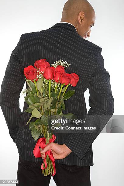 Man Carrying Roses 608 Black Man Holding Rose Stock Photos, High-Res Pictures, and Images ...