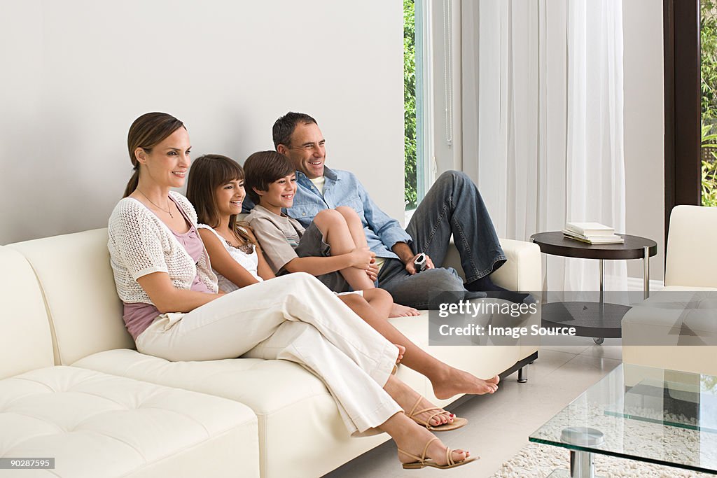 Family relaxing on a sofa