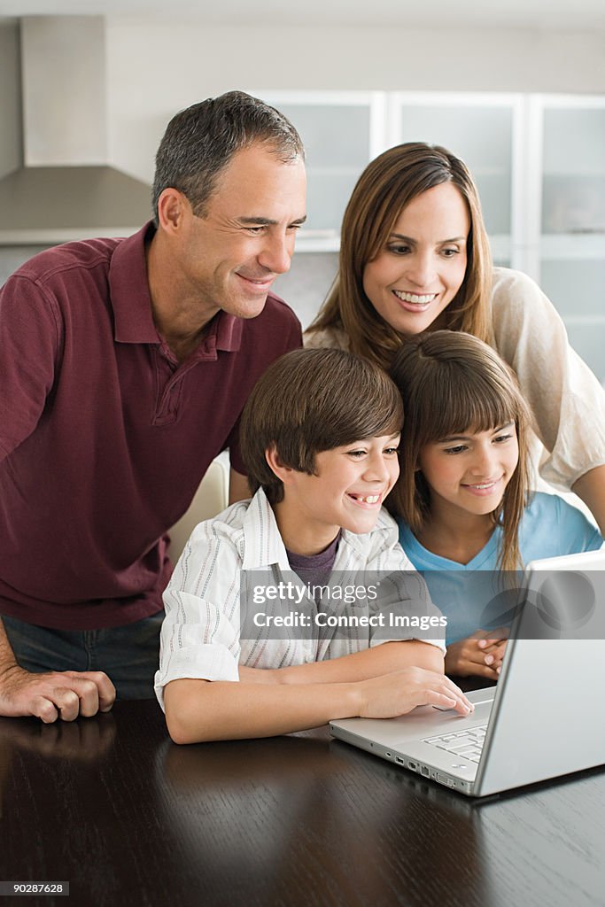 Family using a laptop computer