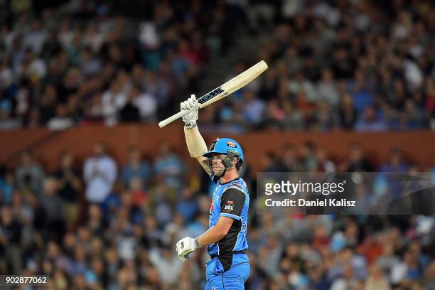 Travis Head of the Adelaide Strikers reacts after reaching his half century during the Big Bash League match between the Adelaide Strikers and the...
