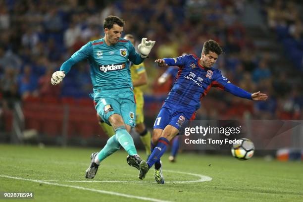 Patricio Rodriguez of the Jets contests the ball with Ben Kennedy of the Mariners during the round 15 A-League match between the Newcastle Jets and...