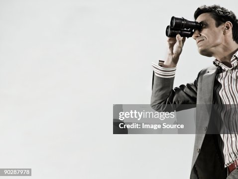 Man using binoculars Man using binoculars