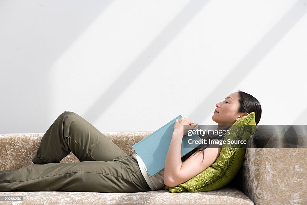 Japanese woman sleeping on sofa