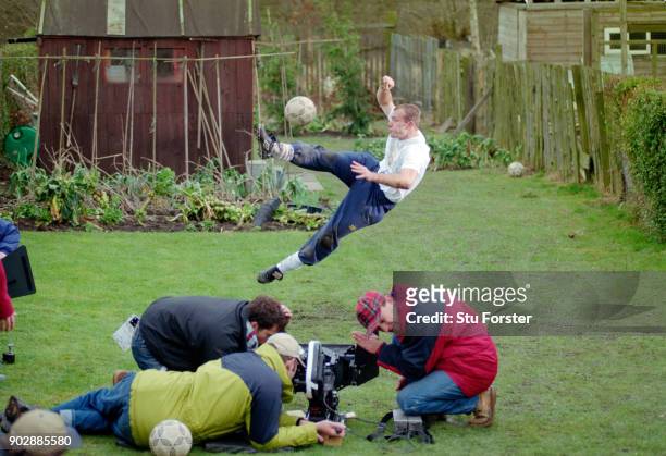 England and Newcastle United striker Alan Shearer in action during filming for a Lucozade TV commercial shoot at a house in Tow Law, County Durham on...