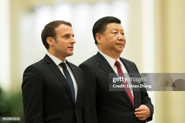 Chinese President Xi Jinping invites French President Emmanuel Macron to view an honour guard during a welcoming ceremony inside the Great Hall of...