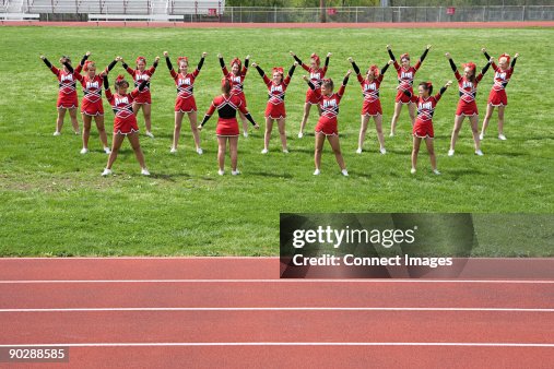Cheerleaders performing routine Cheerleaders performing routine