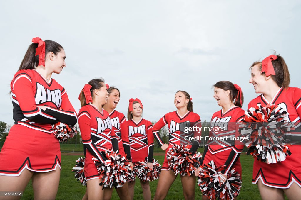 Cheerleaders laughing