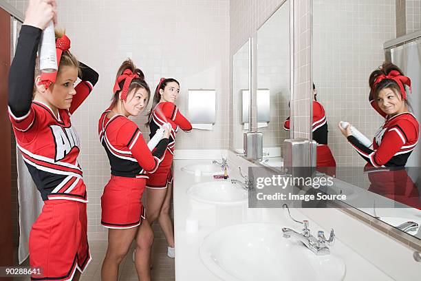 cheerleaders in restroom - black cheerleaders stock pictures, royalty-free photos & images