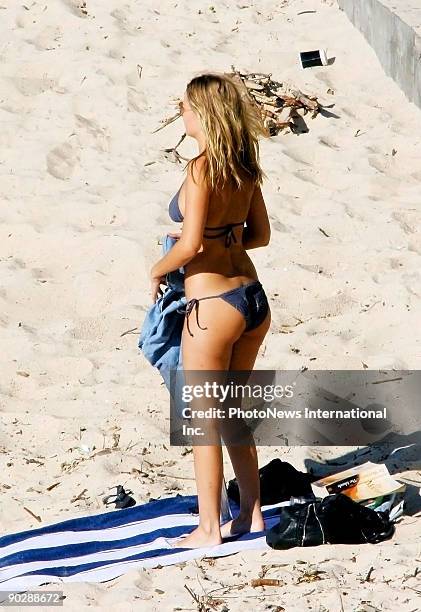 Model Lara Bingle is seen sunbathing at Bondi Beach on August 31, 2009 in Sydney, Australia.