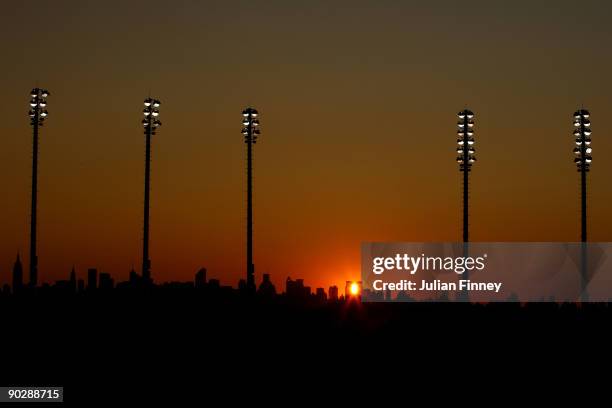 The sunsets over the Manhattan skyline as seen from Arthur Ashe stadium during day two of the 2009 U.S. Open at the USTA Billie Jean King National...