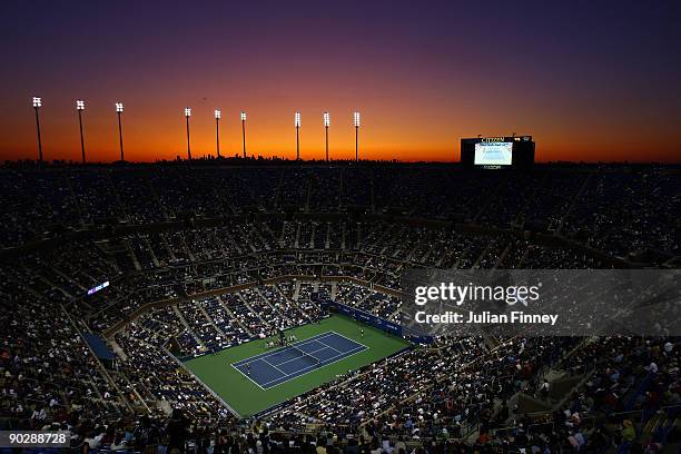 The sunsets over Arthur Ashe Stadium as Maria Sharapova of Russia takes on Tsvetana Pironkova of Bulgaria during day two of the 2009 U.S. Open at the...