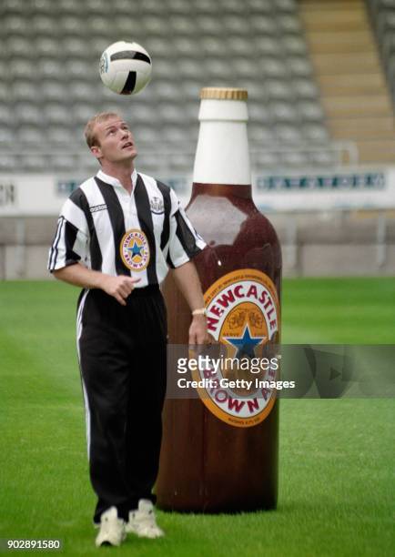 England captain Alan Shearer juggles a ball in front of a giant bottle of Newcastle Brown Ale at his unveiling as a Newcastle United player for a...