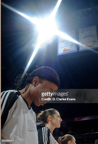 Vickie Johnson of the San Antonio Silver Stars bows her head during the National Anthem on Vickie Johnson Appreciation Night prior to the Stars game...