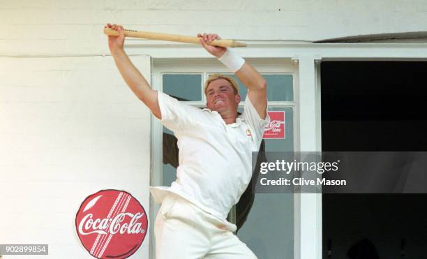 Shane Warne of Australia celebrates victory by dancing with a stump on the dressing room balcony after victory over England in the Fifth Ashes Test...