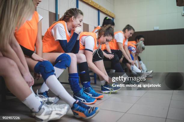 high school girls in the locker room - girls volleyball stock pictures, royalty-free photos & images