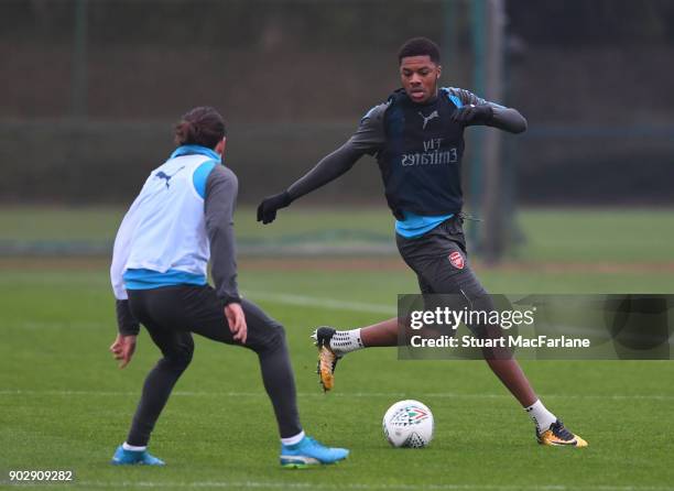 Hector Bellerin and Chuba Akpom of Arsenal during a training session at London Colney on January 9, 2018 in St Albans, England.