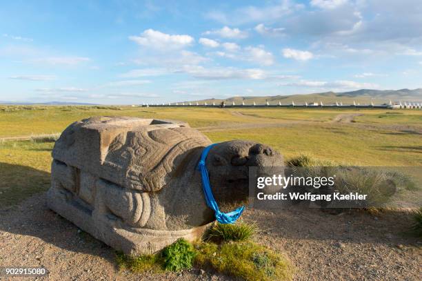 Giant Stone tortoise with the Erdene Zuu monastery in Kharakhorum , Mongolia in background.