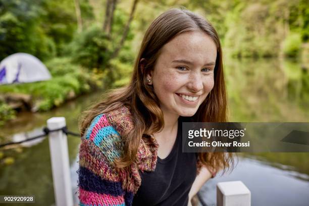 portrait of a happy teenage girl on a houseboat - freckle girl foto e immagini stock