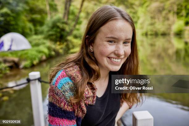 portrait of a happy teenage girl on a houseboat - freckle girl stock pictures, royalty-free photos & images