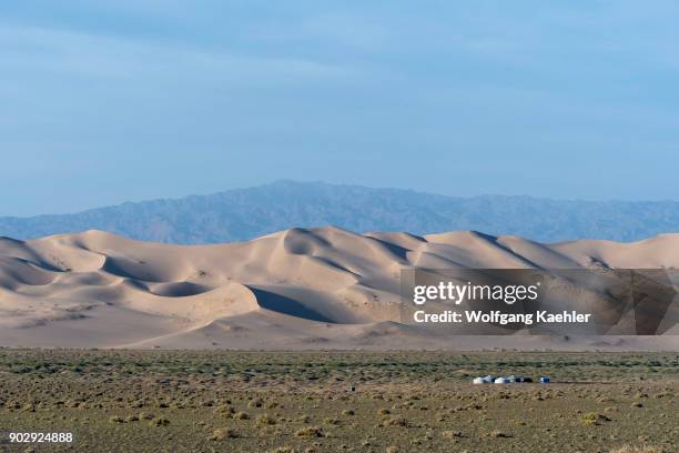 Herder ger camp in front of the Hongoryn Els sand dunes in the Gobi Desert in southern Mongolia.