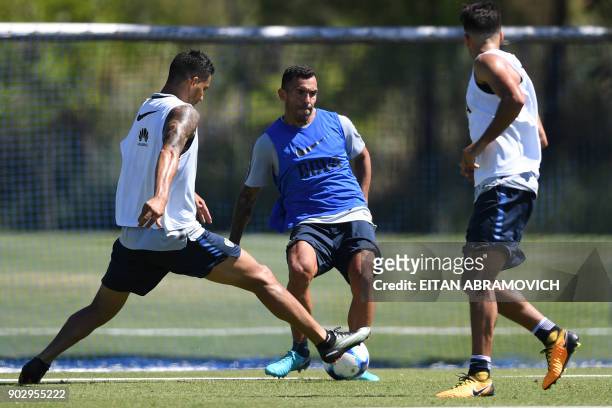 Argentine footballer Carlos Tevez takes part in a training session at Los Cardales, Buenos Aires province, on January 9, 2018. Former Manchester...