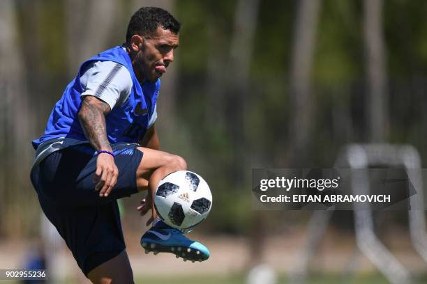 Argentine footballer Carlos Tevez takes part in a training session at Los Cardales, Buenos Aires province, on January 9, 2018. Former Manchester...