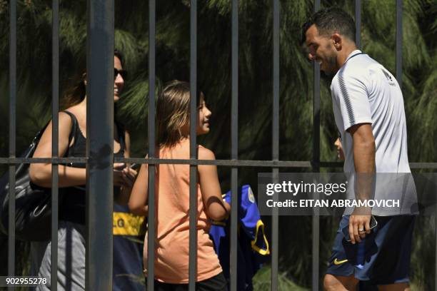 Argentine footballer Carlos Tevez greets fans after a training session at Los Cardales, Buenos Aires province, on January 9, 2018. Former Manchester...