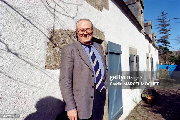 France's far-righter candidate to the upcoming presidential election Jean Marie Le Pen poses 30 March 1995 in the garden of his cottage in La...