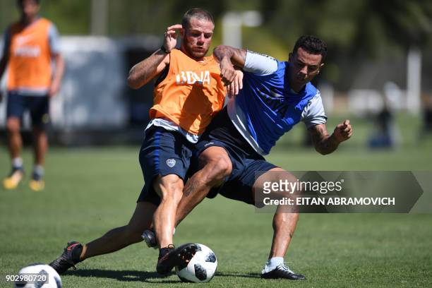 Boca Juniors' footballers Uruguayan Nahitan Nandez and Colombian Edwin Cardona vie for the ball during a training session at Los Cardales, Buenos...