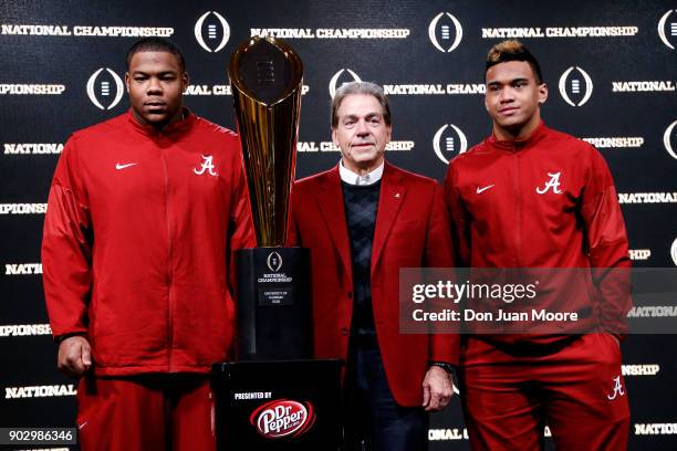 Defensive Lineman Da'Ron Payne, Head Coach Nick Saban and Quarterback Tua Tagovailoa poses with the National Championship Trophy presented by Dr....