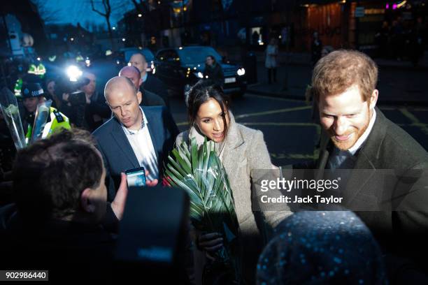 Prince Harry and Meghan Markle meet well-wishers during a visit to Reprezent 107.3FM on January 9, 2018 in London, England. The Reprezent training...