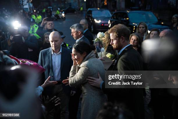 Prince Harry and Meghan Markle meet well-wishers during a visit to Reprezent 107.3FM on January 9, 2018 in London, England. The Reprezent training...