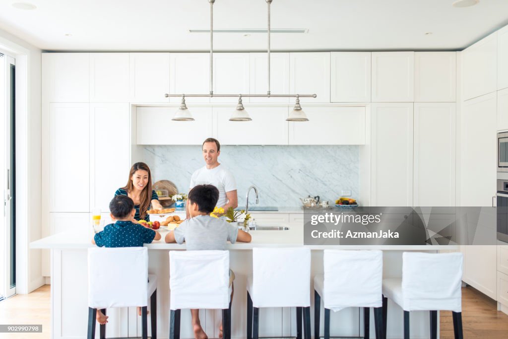 Family eating breakfast in the kitchen