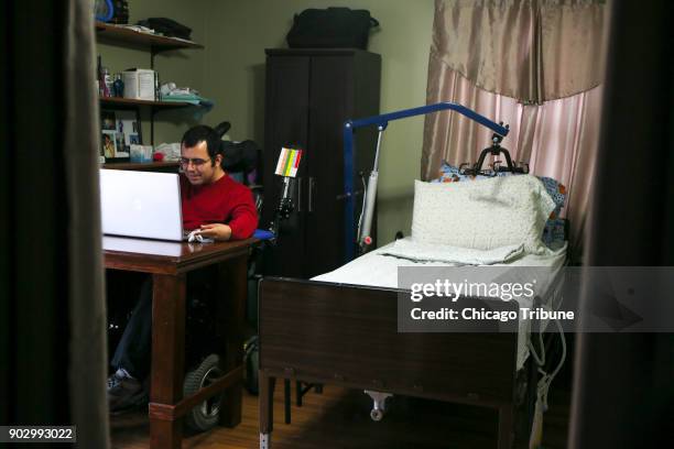 Jose Rodriguez Jr. Writes on his computer at home on Wednesday, Dec. 13, 2017 in Aurora, Ill. In August of 2013, Rodriquez Jr. Suffered a stroke at...