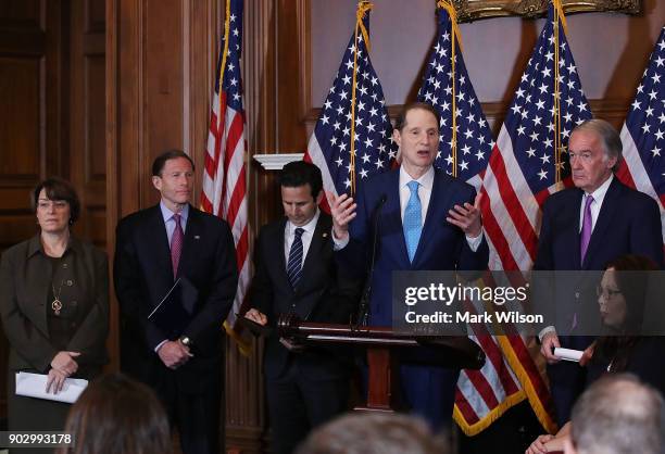 Sen. Ron Wyden is flanked by Amy Klobuchar , Richard Blumenthal , Brian Schatz , Ed Markey and Tammy Duckworth while speaking about a Congressional...