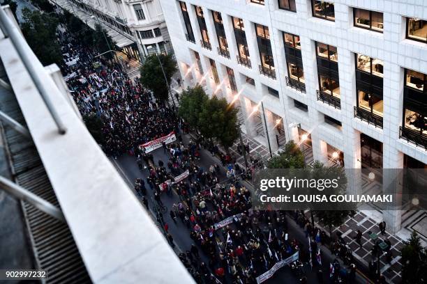 Communist-affiliated PAME workers unionists gather outside the Ministry of Labour in Athens on January 9, 2018 during a protest against a law...