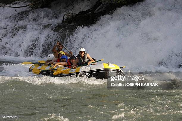Tourists practice rafting in the waters of Al-Assi river in Lebanon's Hermel region in the eastern Bekaa valley, near the border with Syria, on July...