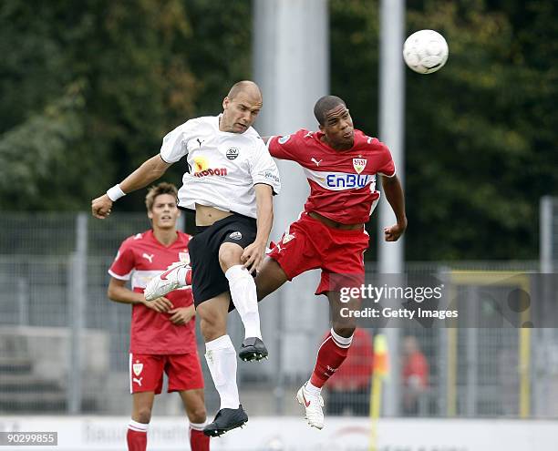 Marcel Schuon of Sandhausen goes up for a header against Daniel Didavi of Stuttgart during the 3. Liga match between SV Sandhausen and VfB Stuttgart...