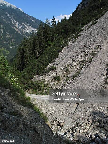 Female Mountainbiker on tour through the valley of Tegestal to the mountain hut Tarrenton Alm on August 1, 2009 in Nassereith near Innsbruck, Austria.