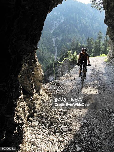 Female Mountainbiker on tour through the valley of Tegestal to the mountain hut Tarrenton Alm. On August 1, 2009 in Nassereith near Innsbruck,...