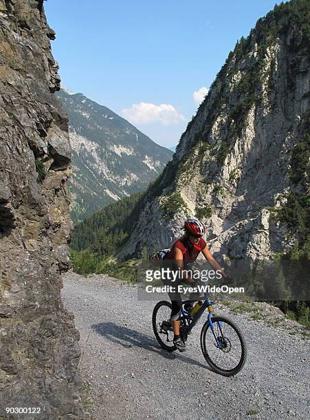 Female Mountainbiker on a tour through the valley of Tegestal to the mountain hut Tarrenton Alm. On August 1, 2009 in Nassereith near Innsbruck,...