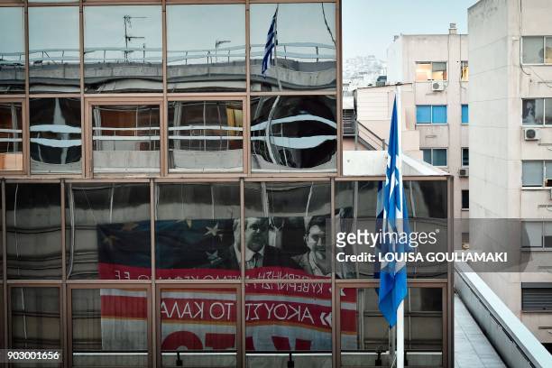 Banner reading 'Hands off strikes' and featuring Greek prime minister Alexis Tsipras and Defence Minister Panos Kammenos hung by Communist-affiliated...